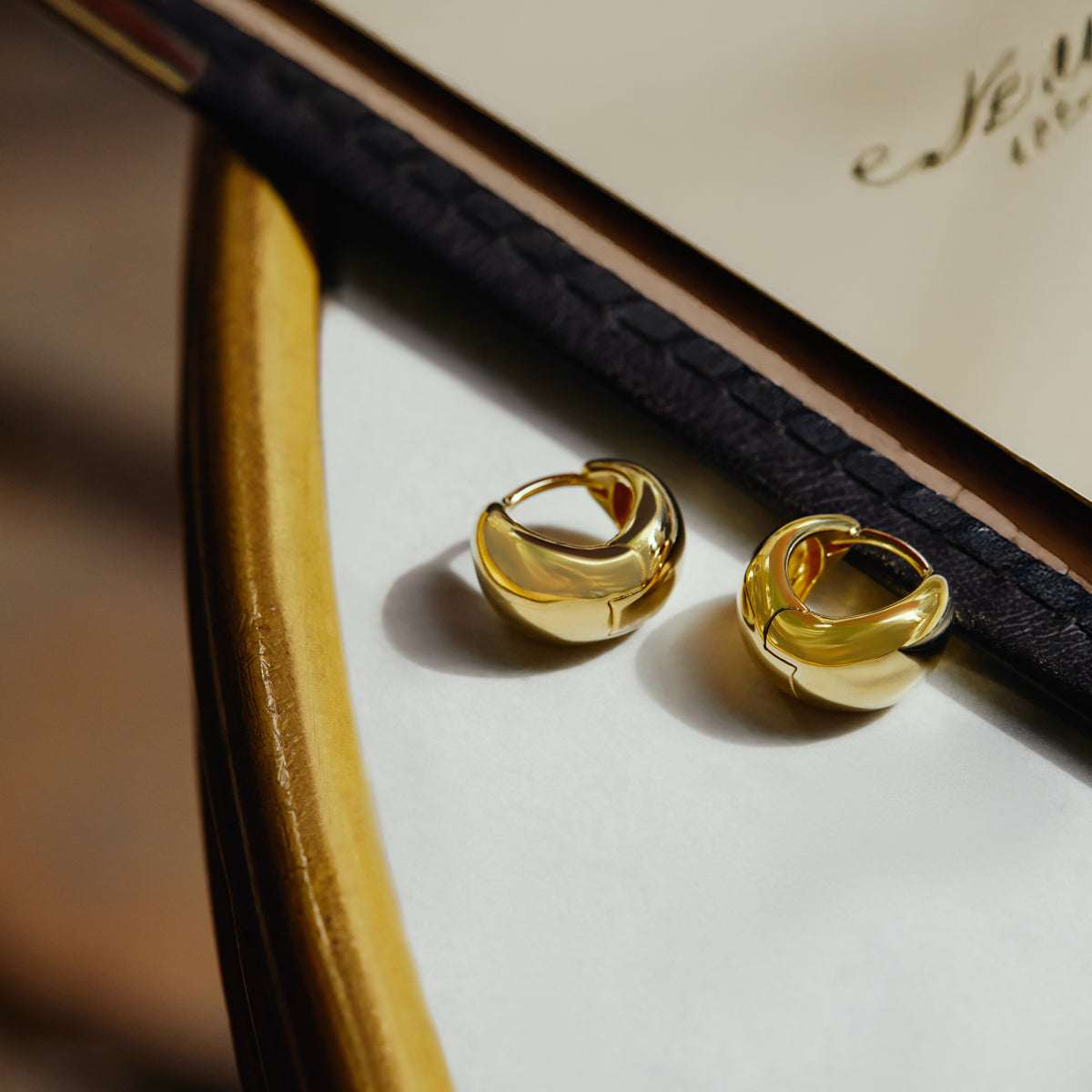La Muse Huggie Earrings